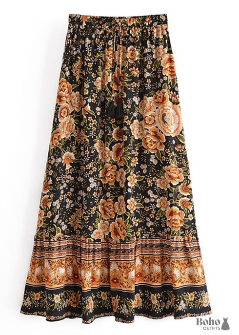 Faldas bohemias con estampado Maryam de flores negras y doradas para mujer